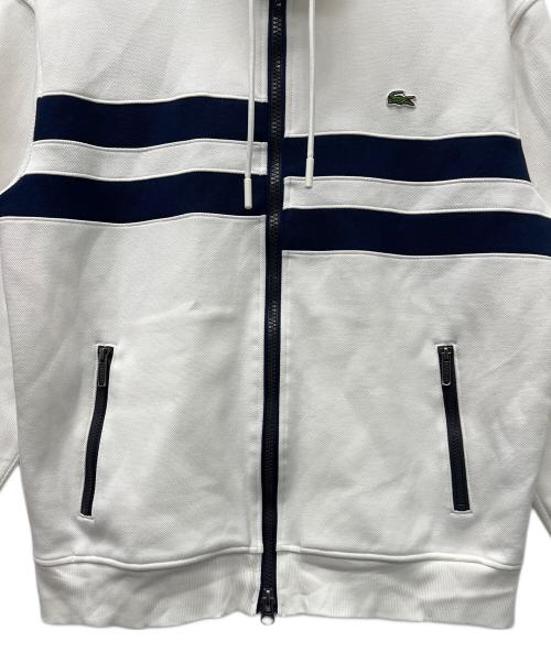 LACOSTE（ラコステ）LACOSTE (ラコステ) アシンメトリーボーダーハイネックジャケット ホワイト×ネイビー サイズ:Ｌの古着・服飾アイテム
