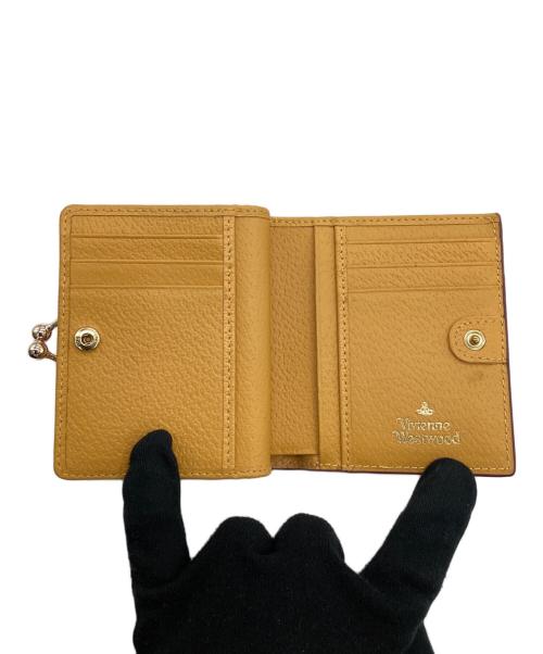 Vivienne Westwood（ヴィヴィアンウエストウッド）Vivienne Westwood (ヴィヴィアンウエストウッド) がま口財布 イエローの古着・服飾アイテム