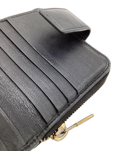 Yves Saint Laurent（イヴサンローラン）Yves Saint Laurent (イヴサンローラン) 2つ折り ラウンドジップウォレット ブラックの古着・服飾アイテム