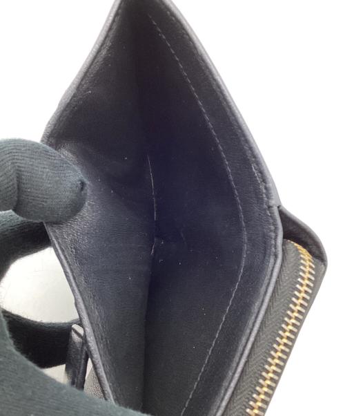 Yves Saint Laurent（イヴサンローラン）Yves Saint Laurent (イヴサンローラン) 2つ折り ラウンドジップウォレット ブラックの古着・服飾アイテム