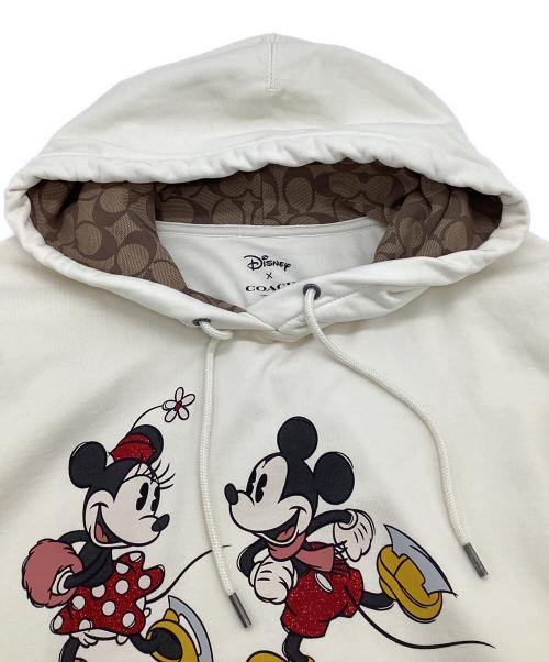 COACH（コーチ）COACH (コーチ) DISNEY (ディズニー) アイス スケート モチーフ フーディー ベージュ サイズ:Lの古着・服飾アイテム