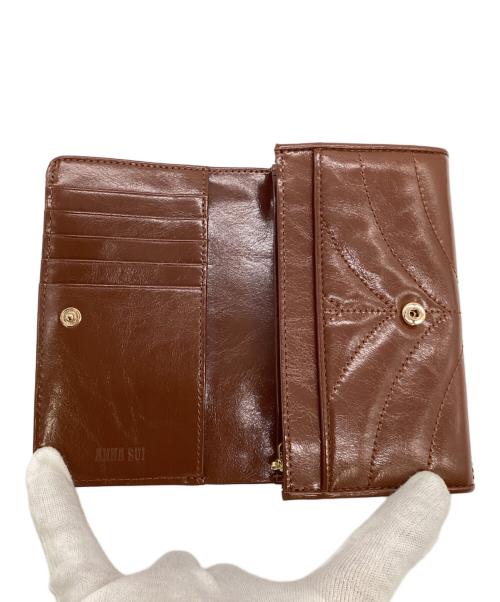 ANNA SUI（アナスイ）ANNA SUI (アナスイ) ポワロ 2つ折り財布 ブラウンの古着・服飾アイテム