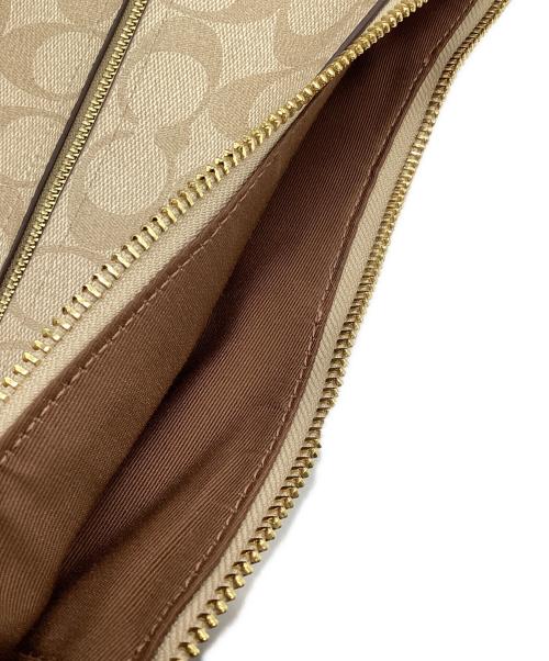 COACH（コーチ）COACH (コーチ) エリー ファイル バッグ シグネチャー キャンバス ストライプ アイボリーの古着・服飾アイテム