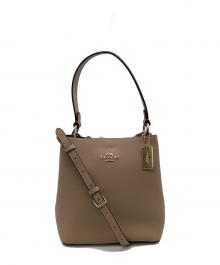 COACH（コーチ）の古着「スモールタウンバケットバッグ」｜ベージュ