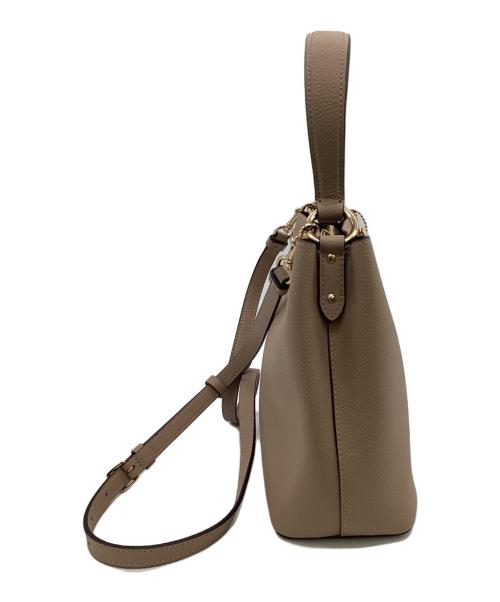 COACH（コーチ）COACH (コーチ) スモールタウンバケットバッグ ベージュの古着・服飾アイテム