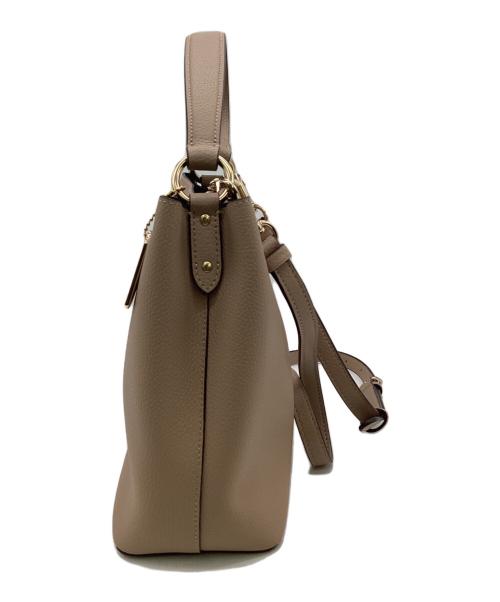 COACH（コーチ）COACH (コーチ) スモールタウンバケットバッグ ベージュの古着・服飾アイテム