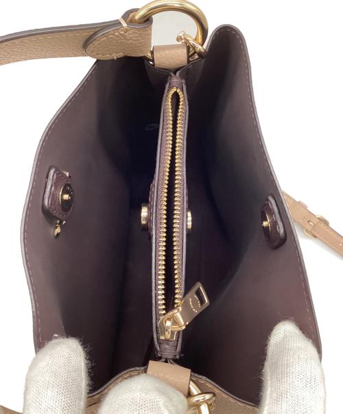 COACH（コーチ）COACH (コーチ) スモールタウンバケットバッグ ベージュの古着・服飾アイテム