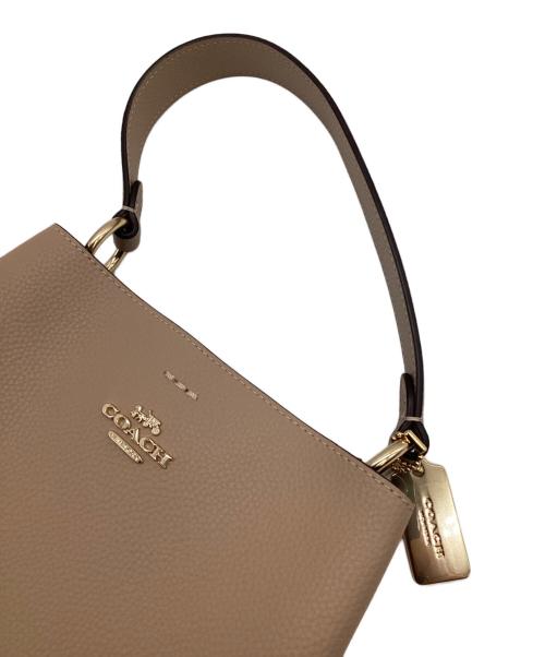 COACH（コーチ）COACH (コーチ) スモールタウンバケットバッグ ベージュの古着・服飾アイテム