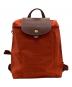 LONGCHAMP（ロンシャン）の古着「ルプリアージュ リュック」｜オレンジ