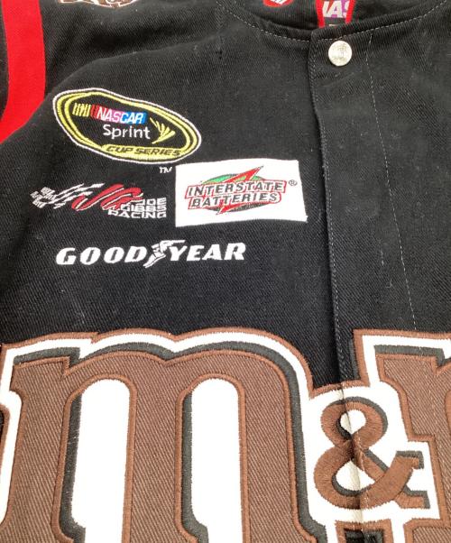 NASCAR by JH Design（ナスカーバイジェイエイチデザイン）NASCAR by JH Design (ナスカーバイジェイエイチデザイン) M&M (エムアンドエム) M&M's レーシングジャケット ブラック×レッド サイズ:Lの古着・服飾アイテム