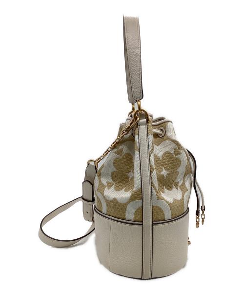 Kate Spade（ケイトスペード）Kate Spade (ケイトスペード) スペードフラワーモノグラムラフィアグラマシーミディアムバケットバッグ ベージュの古着・服飾アイテム