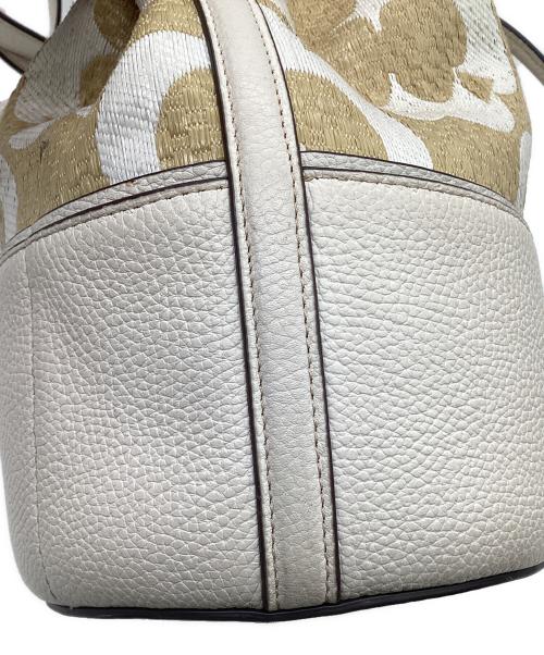Kate Spade（ケイトスペード）Kate Spade (ケイトスペード) スペードフラワーモノグラムラフィアグラマシーミディアムバケットバッグ ベージュの古着・服飾アイテム