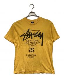 stussy（ステューシー）の古着「WORLD TOUR（ワールドツアー）Tシャツ」｜イエロー
