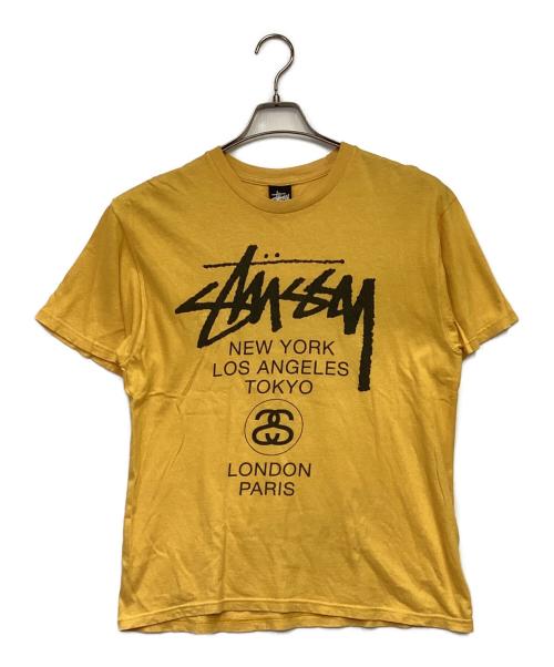 stussy（ステューシー）stussy (ステューシー) WORLD TOUR（ワールドツアー）Tシャツ イエロー サイズ:Mの古着・服飾アイテム