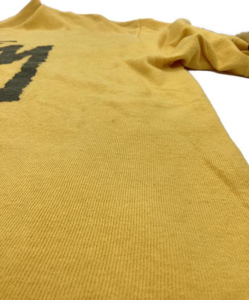 stussy（ステューシー）stussy (ステューシー) WORLD TOUR（ワールドツアー）Tシャツ イエロー サイズ:Mの古着・服飾アイテム