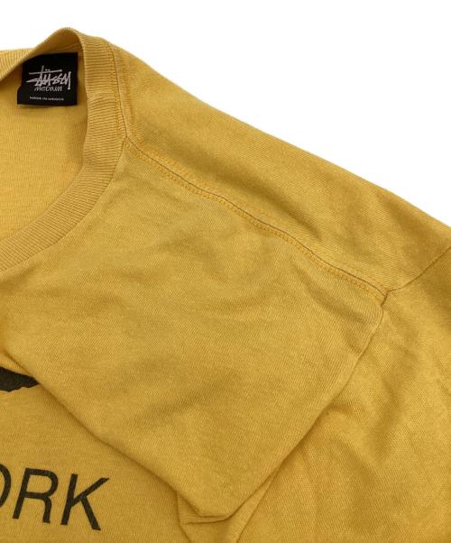 stussy（ステューシー）stussy (ステューシー) WORLD TOUR（ワールドツアー）Tシャツ イエロー サイズ:Mの古着・服飾アイテム