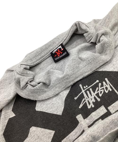stussy（ステューシー）stussy (ステューシー) 東京 BALLERS L/Sカットソー グレー サイズ:Mの古着・服飾アイテム