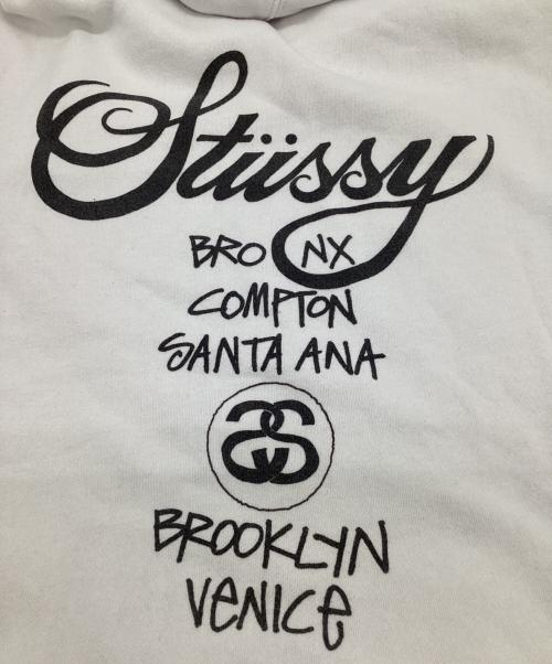stussy（ステューシー）stussy (ステューシー) WORLD TOUR HOODIE（ワールド ツアー フーディー） ホワイト サイズ:Mの古着・服飾アイテム