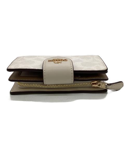COACH（コーチ）COACH (コーチ) ミディアム コーナー ジップ ウォレット シグネチャー キャンバス ベージュの古着・服飾アイテム