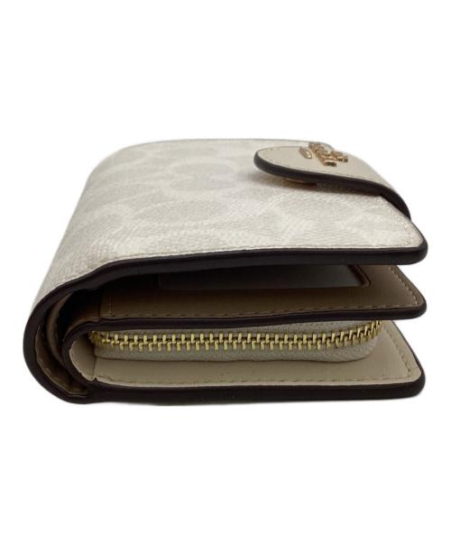 COACH（コーチ）COACH (コーチ) ミディアム コーナー ジップ ウォレット シグネチャー キャンバス ベージュの古着・服飾アイテム