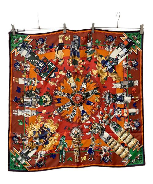 HERMES（エルメス）HERMES (エルメス) 大判スカーフ Kachinas カレ90 ブラウン×オレンジの古着・服飾アイテム