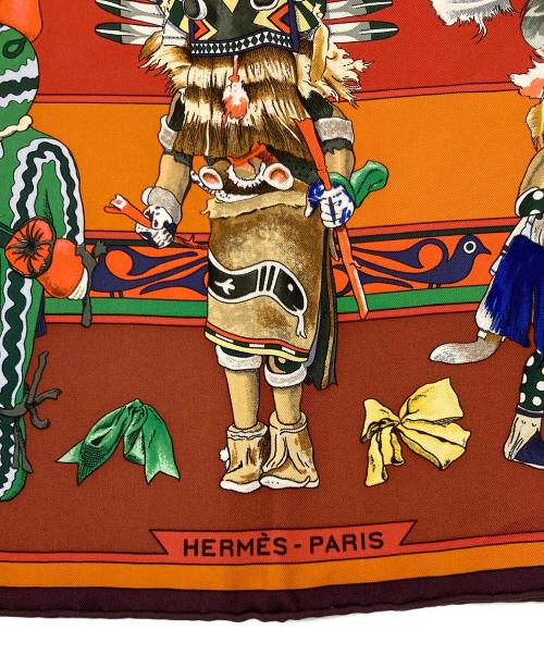 HERMES（エルメス）HERMES (エルメス) 大判スカーフ Kachinas カレ90 ブラウン×オレンジの古着・服飾アイテム