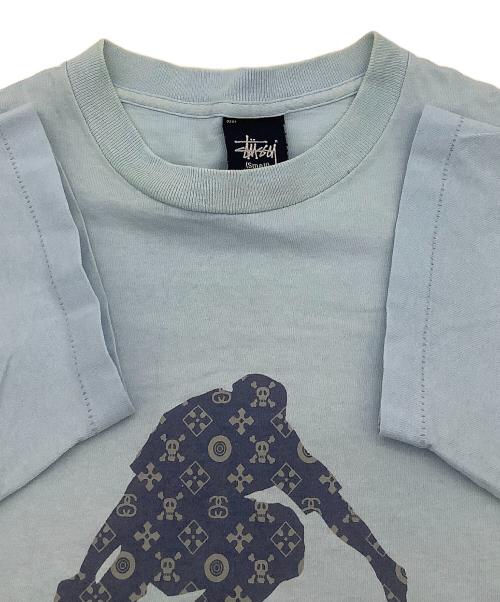 stussy（ステューシー）stussy (ステューシー) 半袖カットソー MONOGRAM SKATE MAN TEE 90's スカイブルー サイズ:Smallの古着・服飾アイテム