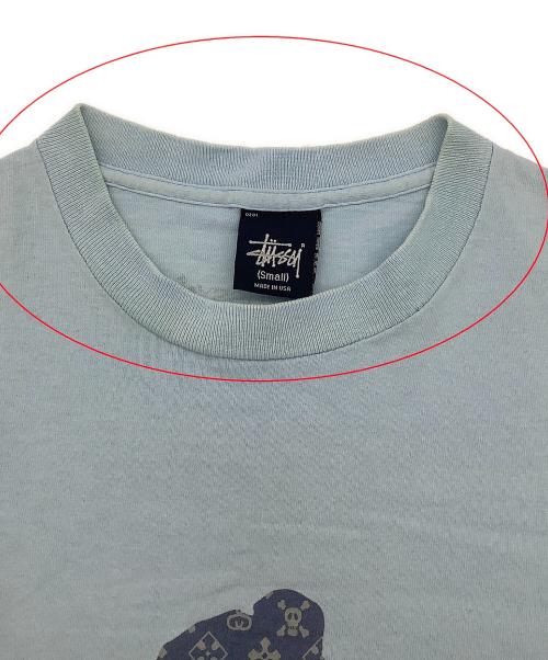 stussy（ステューシー）stussy (ステューシー) 半袖カットソー MONOGRAM SKATE MAN TEE 90's スカイブルー サイズ:Smallの古着・服飾アイテム