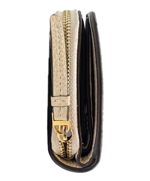 TORY BURCH（トリーバーチ）TORY BURCH (トリーバーチ) TORY BURCH　2つ折り財布 アイボリーの古着・服飾アイテム