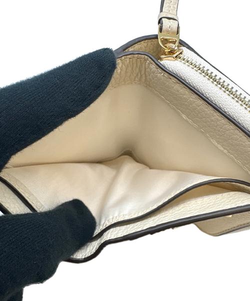 TORY BURCH（トリーバーチ）TORY BURCH (トリーバーチ) TORY BURCH　2つ折り財布 アイボリーの古着・服飾アイテム