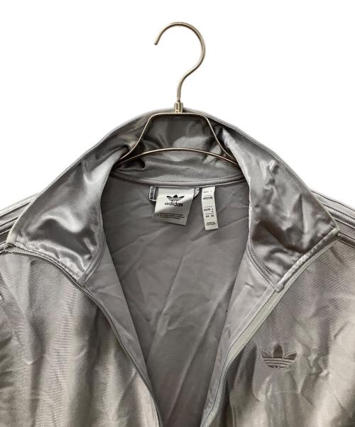 adidas（アディダス）adidas (アディダス) オーバーサイズ ファイヤーバード トラックトップ シルバーカラー サイズ:Mの古着・服飾アイテム