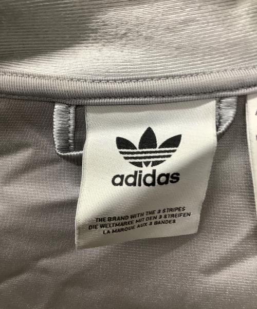 adidas（アディダス）adidas (アディダス) オーバーサイズ ファイヤーバード トラックトップ シルバーカラー サイズ:Mの古着・服飾アイテム