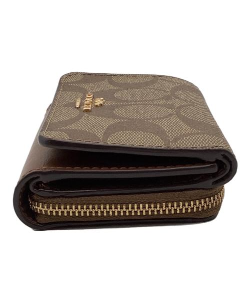 COACH（コーチ）COACH (コーチ) シグネチャー コンパクトウォレット ベージュの古着・服飾アイテム