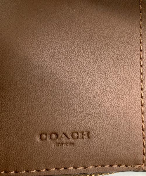 COACH（コーチ）COACH (コーチ) シグネチャー コンパクトウォレット ベージュの古着・服飾アイテム