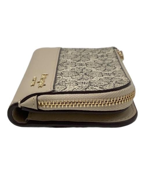 Kate Spade（ケイトスペード）Kate Spade (ケイトスペード) フラワー スモール スリム バイフォールド ウォレット ベージュの古着・服飾アイテム
