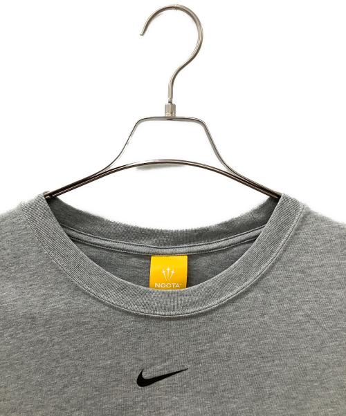 NIKE（ナイキ）NIKE (ナイキ) NOCTA (ノクタ) ショートスリーブ 063D グレー サイズ:XLの古着・服飾アイテム