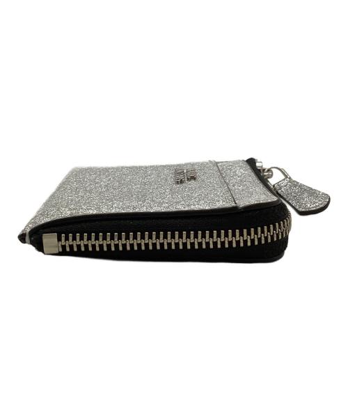 MARC JACOBS（マークジェイコブス）MARC JACOBS (マークジェイコブス) コーテッド グリッター トップジップウォレット シルバーの古着・服飾アイテム