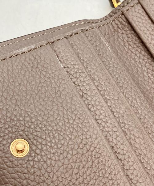 TORY BURCH（トリーバーチ）TORY BURCH (トリーバーチ) 2つ折り財布 グレーの古着・服飾アイテム