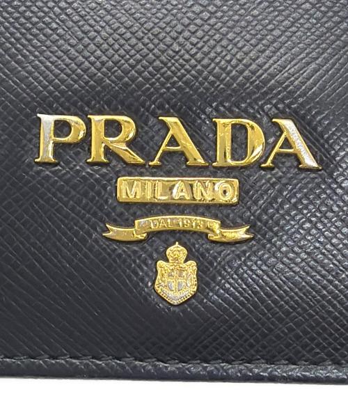 PRADA（プラダ）PRADA (プラダ) 2つ折り財布 ブラック×ピンクの古着・服飾アイテム