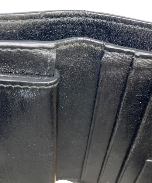 TOM FORD（トムフォード）TOM FORD (トムフォード) 型押し2つ折り財布 ブラウンの古着・服飾アイテム