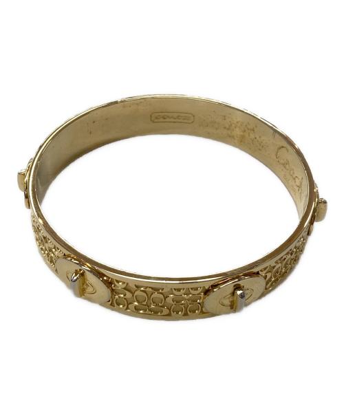 COACH（コーチ）COACH (コーチ) ターンロックモチーフバングル ゴールド【色】の古着・服飾アイテム