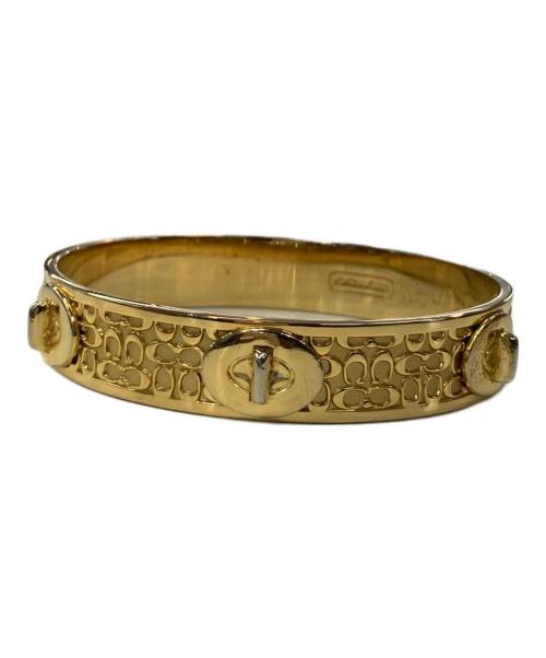 COACH（コーチ）COACH (コーチ) ターンロックモチーフバングル ゴールド【色】の古着・服飾アイテム