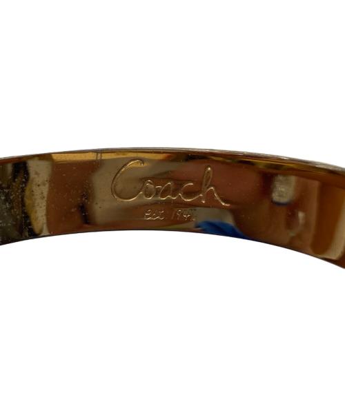 COACH（コーチ）COACH (コーチ) ターンロックモチーフバングル ゴールド【色】の古着・服飾アイテム