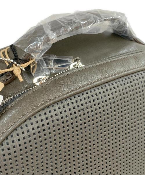 totem re vooo（トーテムリボー）totem re vooo (トーテムリボー) パンチング加工リュック グレーの古着・服飾アイテム