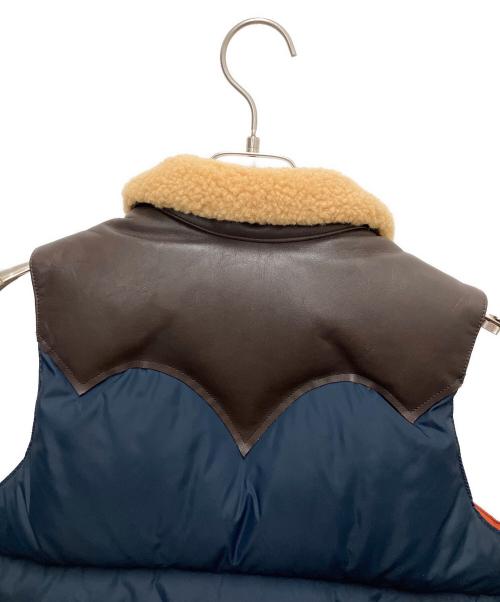 RockyMountainFeatherBed（ロッキーマウンテンフェザーベッド）RockyMountainFeatherBed (ロッキーマウンテンフェザーベッド) 16FW Christy Vest/レザー切替ダウンベスト ネイビー サイズ:7/8の古着・服飾アイテム