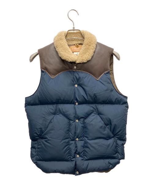 RockyMountainFeatherBed（ロッキーマウンテンフェザーベッド）RockyMountainFeatherBed (ロッキーマウンテンフェザーベッド) ダウンベスト ブラウン×ネイビー サイズ:SIZE Mの古着・服飾アイテム