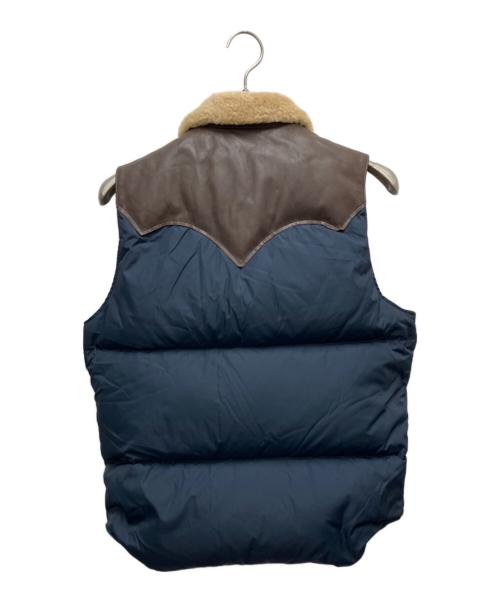 RockyMountainFeatherBed（ロッキーマウンテンフェザーベッド）RockyMountainFeatherBed (ロッキーマウンテンフェザーベッド) ダウンベスト ブラウン×ネイビー サイズ:SIZE Mの古着・服飾アイテム