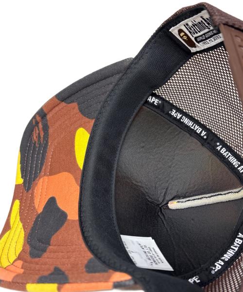 A BATHING APE（ア ベイシング エイプ）A BATHING APE (ア ベイシング エイプ) 1ST CAMO COLLEGE MESH CAP オレンジの古着・服飾アイテム