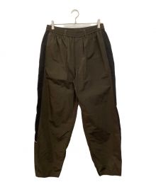 stein（シュタイン）の古着「TRAINER'S TRACK EASY TROUSERS」｜カーキ×ブラック
