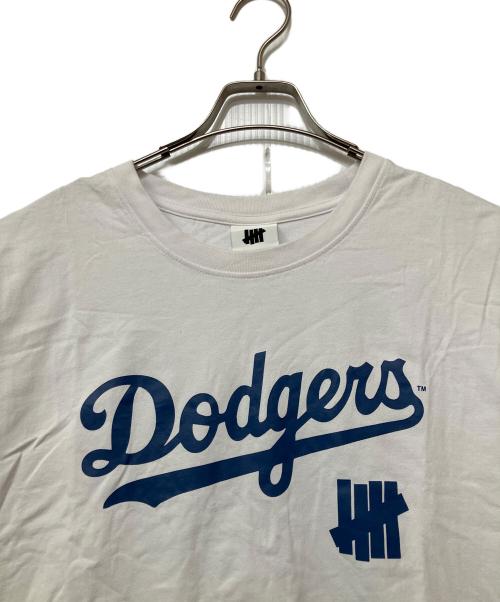 UNDEFEATED（アンディフィーテッド）UNDEFEATED (アンディフィーテッド) LA DODGERS (ロサンゼルス・ドジャース) New Era (ニューエラ) プリントTシャツ ホワイト×ブルー サイズ:XLの古着・服飾アイテム